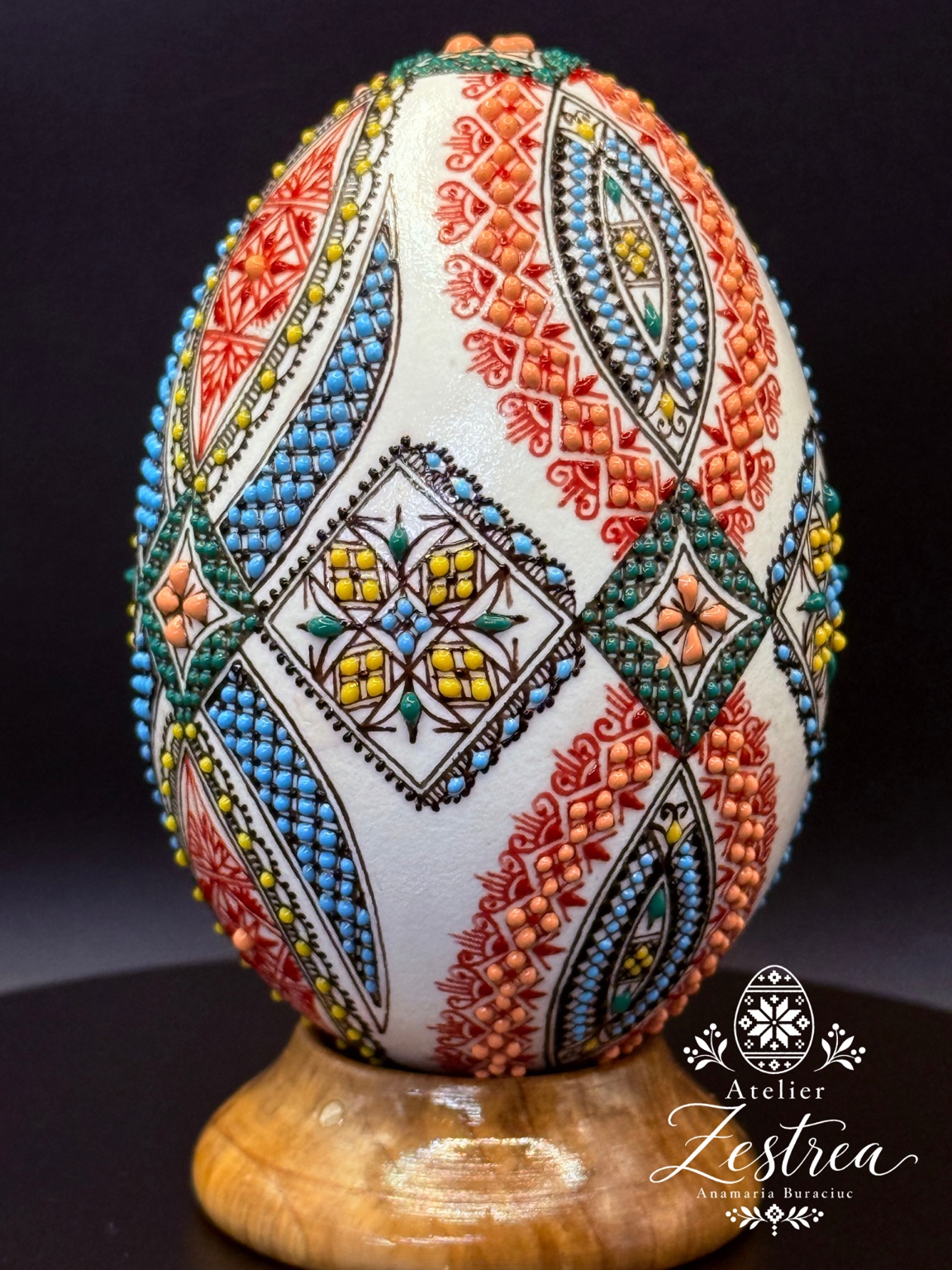 White goose egg with multicoloured diamonds and diagonal raised-wax bands